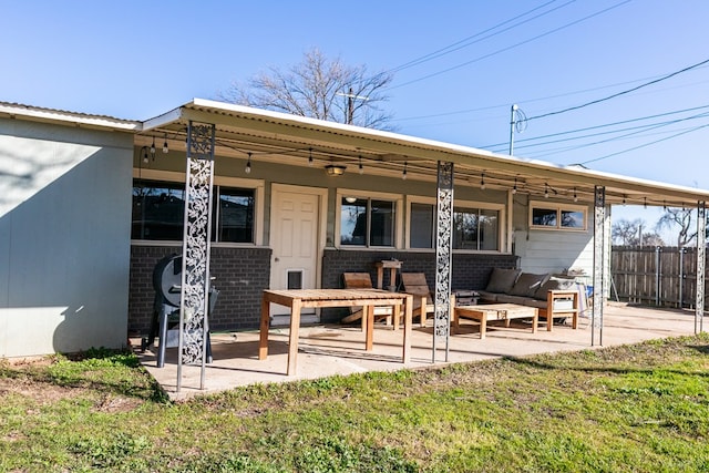 back of house featuring an outdoor hangout area, a lawn, and a patio area