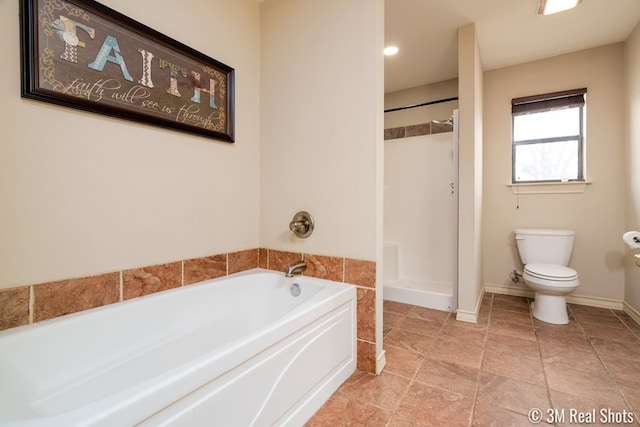 full bathroom with toilet, a shower stall, baseboards, and a bath