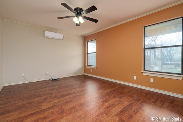 unfurnished room featuring dark wood-type flooring, a wall mounted air conditioner, crown molding, and baseboards