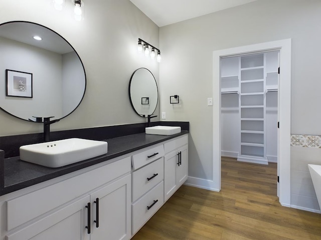 bathroom featuring vanity and hardwood / wood-style flooring