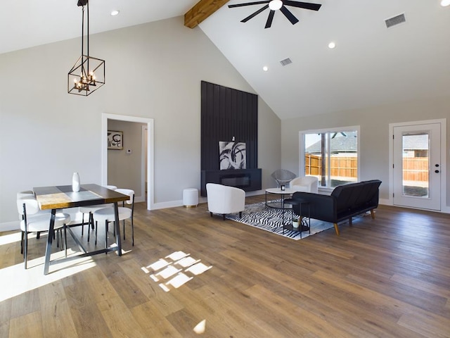 living room featuring beamed ceiling, ceiling fan, hardwood / wood-style floors, and high vaulted ceiling