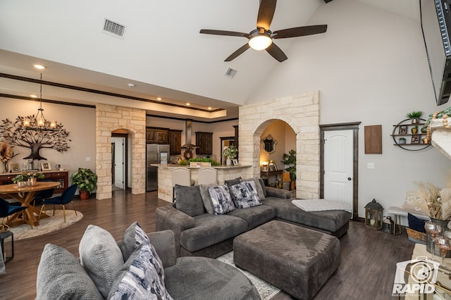 living room featuring arched walkways, visible vents, high vaulted ceiling, and ceiling fan with notable chandelier