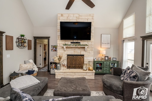 living room with a fireplace, dark wood-style flooring, ceiling fan, and high vaulted ceiling