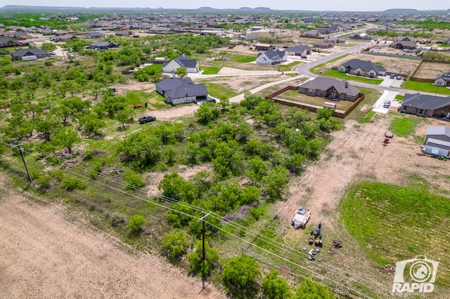 aerial view with a mountain view and a residential view