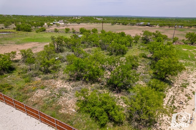 birds eye view of property featuring a rural view