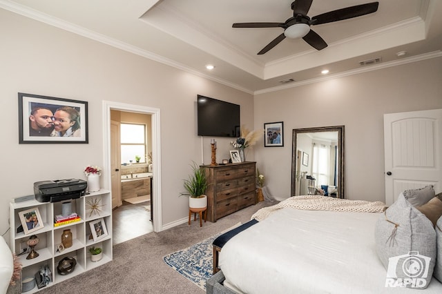 bedroom with carpet flooring, visible vents, a raised ceiling, and crown molding
