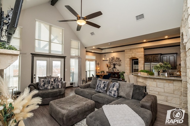 living room featuring beamed ceiling, dark wood-style floors, high vaulted ceiling, ceiling fan, and visible vents