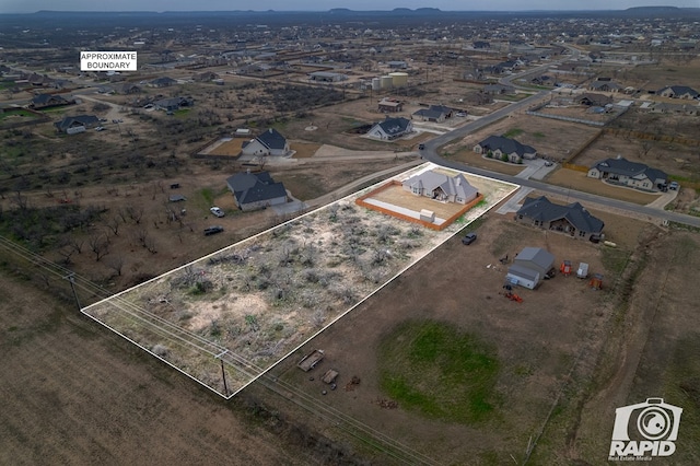 birds eye view of property with a residential view