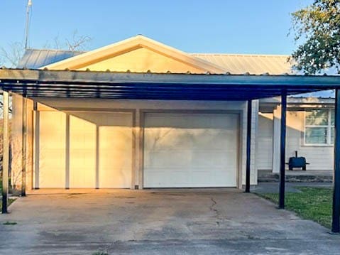 exterior space with a carport