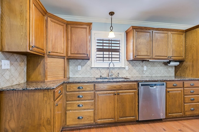 kitchen with sink, decorative backsplash, dark stone counters, and dishwasher