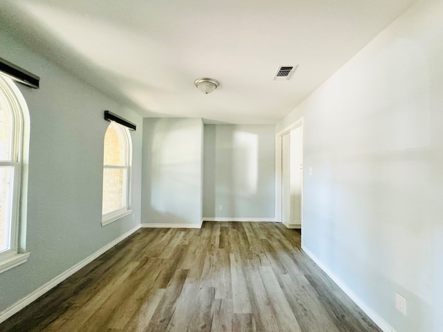 unfurnished room with light hardwood / wood-style floors