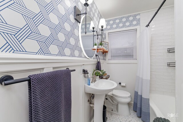 full bathroom with tile patterned flooring, sink, shower / bathtub combination with curtain, and toilet