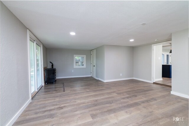 unfurnished living room with light wood-type flooring