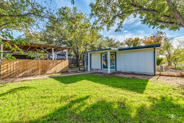 view of outbuilding featuring a yard