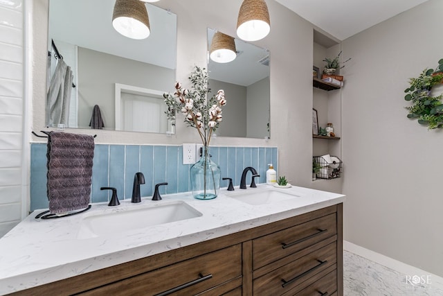 bathroom featuring tasteful backsplash and vanity