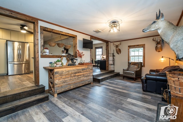 sitting room featuring hardwood / wood-style floors and ornamental molding