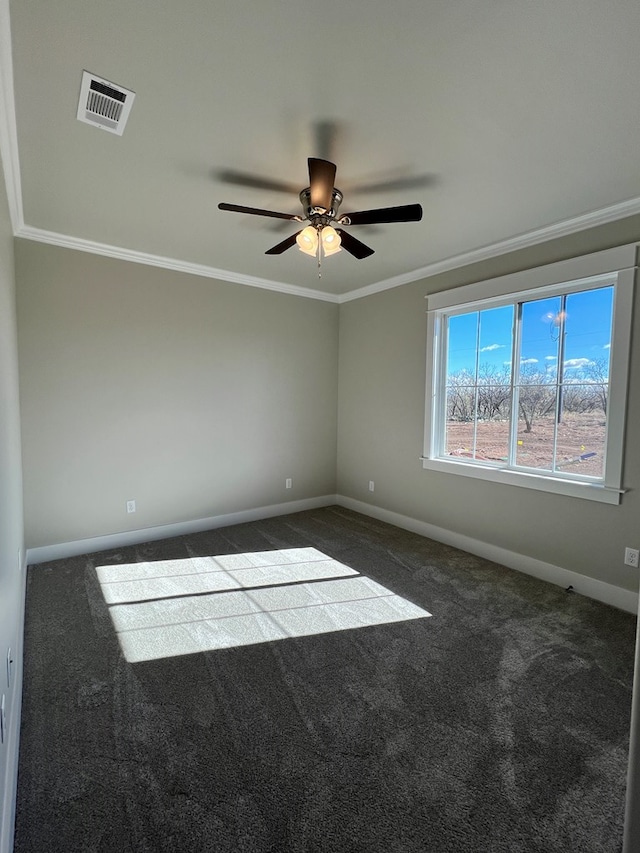 unfurnished room with crown molding, ceiling fan, and dark carpet