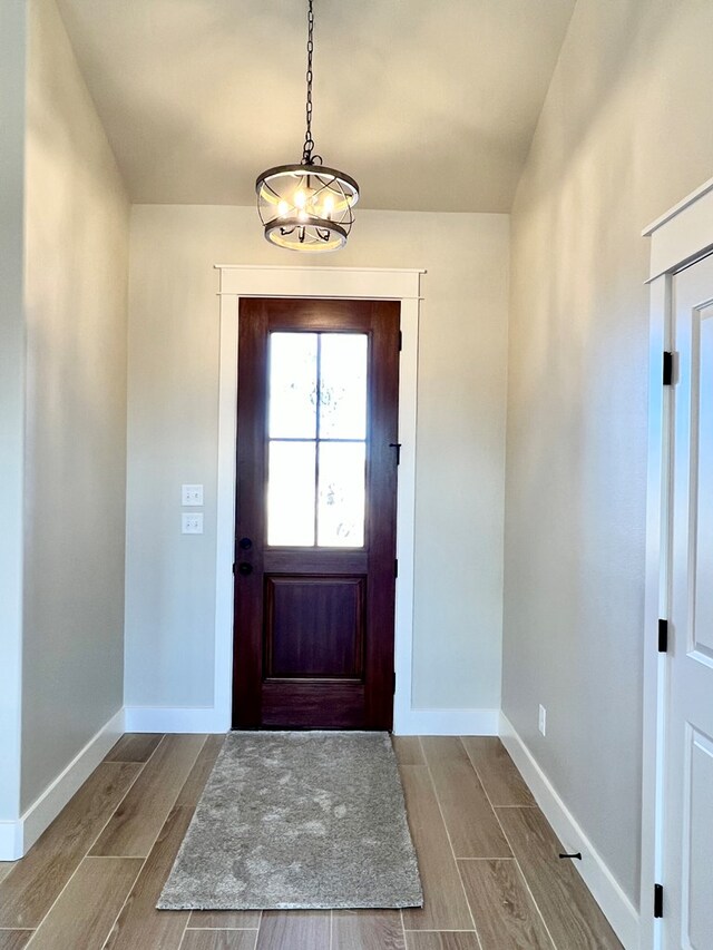 foyer entrance with an inviting chandelier