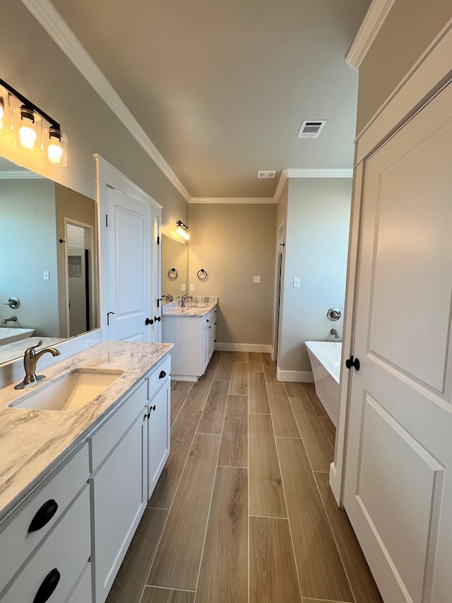 bathroom with crown molding, vanity, and shower with separate bathtub