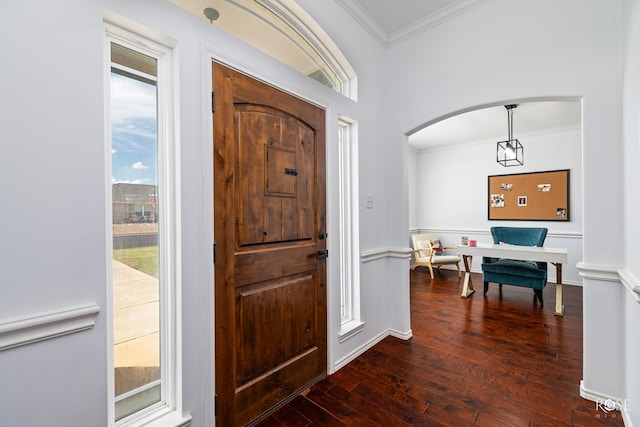 entryway with crown molding and dark hardwood / wood-style floors