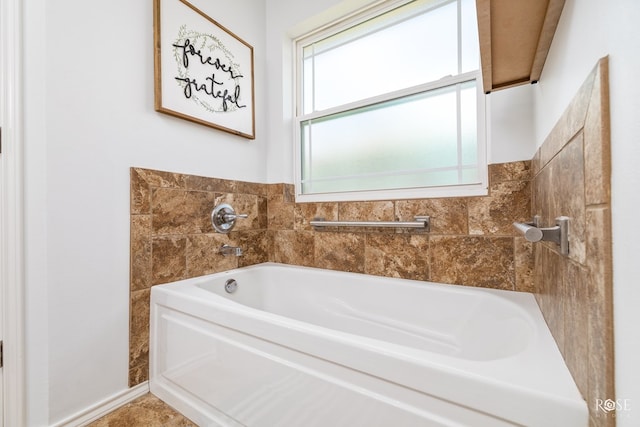 bathroom with a tub