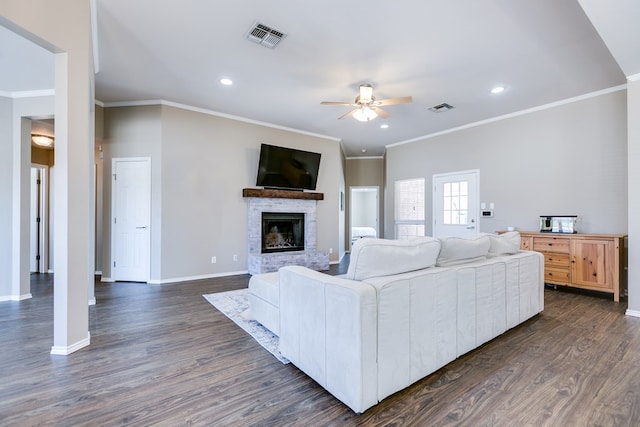 living room with crown molding, ceiling fan, and dark hardwood / wood-style floors