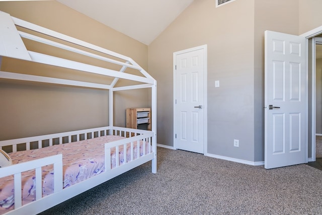 unfurnished bedroom featuring vaulted ceiling and carpet