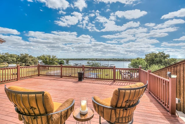 wooden deck featuring a water view