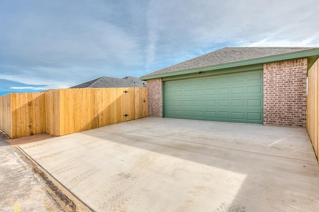 garage with fence