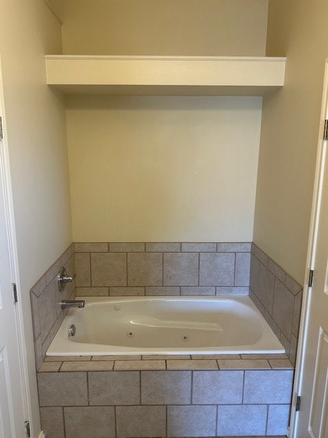 bathroom featuring tiled bath