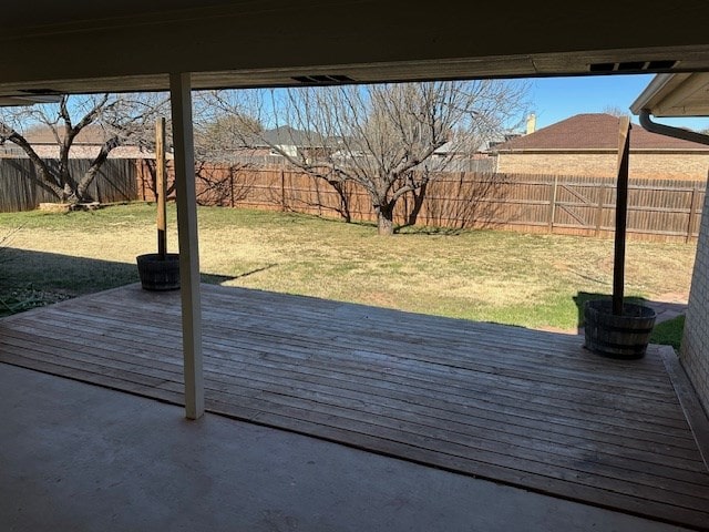 wooden deck featuring a yard