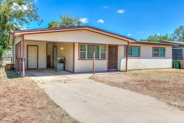 ranch-style house with a carport