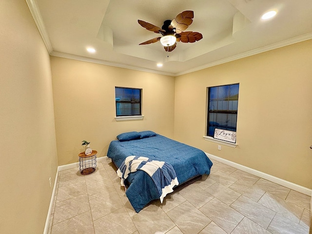 bedroom featuring crown molding, ceiling fan, and a tray ceiling