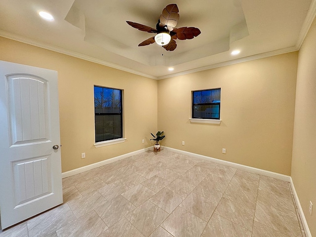 unfurnished room featuring crown molding, ceiling fan, and a tray ceiling