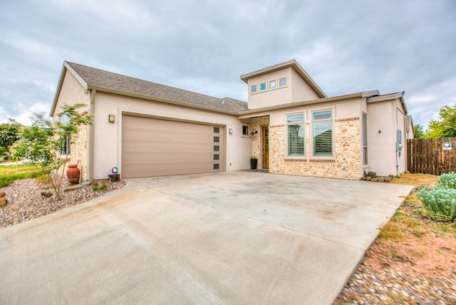 2118 Valleyview Dr, San Angelo, TX 76904 - view of front of property featuring a garage, stucco siding, and driveway
