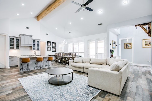 2118 Valleyview Dr, San Angelo, TX 76904 - living room with a chandelier, beam ceiling, high vaulted ceiling, a ceiling fan, and recessed lighting
