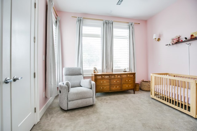 2118 Valleyview Dr, San Angelo, TX 76904 - bedroom with a crib and carpet