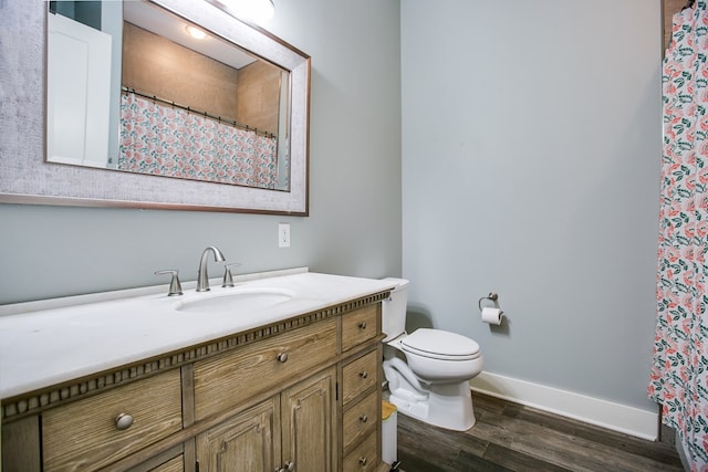 2118 Valleyview Dr, San Angelo, TX 76904 - bathroom with vanity, wood finished floors, and a shower with shower curtain
