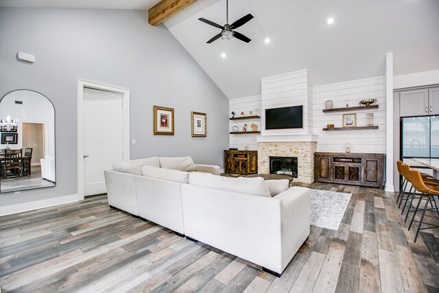 2118 Valleyview Dr, San Angelo, TX 76904 - living room with high vaulted ceiling, beam ceiling, ceiling fan, a fireplace, and wood finished floors