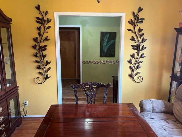 3826 Hillcrest Dr, San Angelo, TX 76904 - dining space featuring dark wood-style floors and baseboards