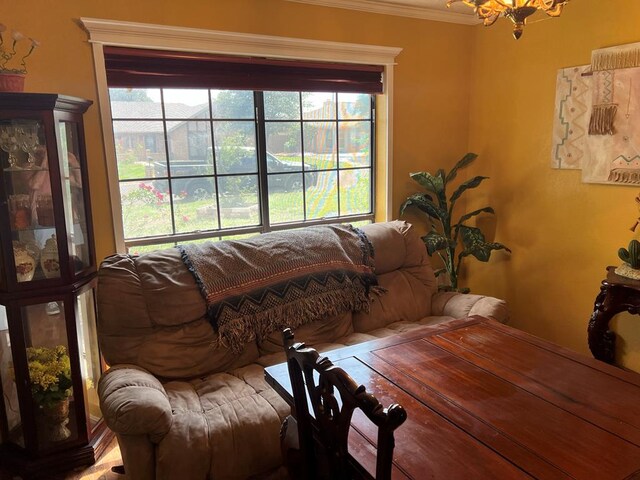 3826 Hillcrest Dr, San Angelo, TX 76904 - living area featuring ornamental molding and an inviting chandelier