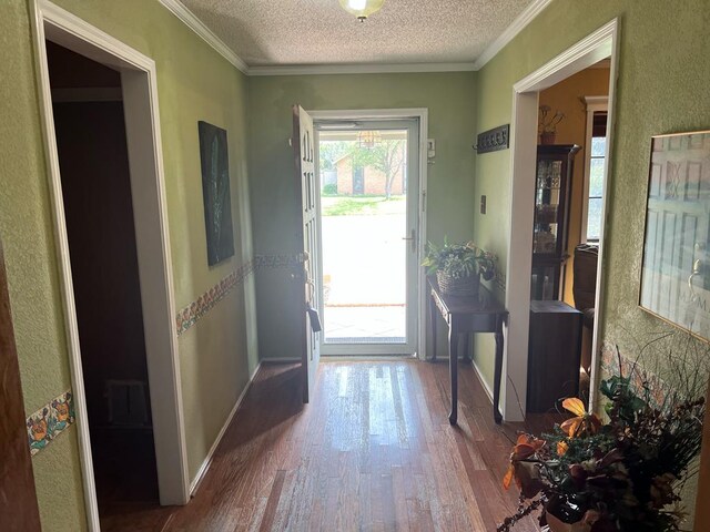 3826 Hillcrest Dr, San Angelo, TX 76904 - entryway featuring baseboards, wood finished floors, and a textured ceiling