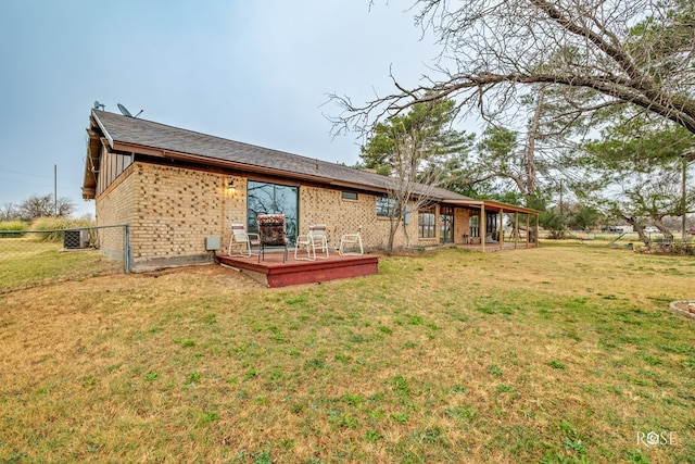 back of property featuring a yard