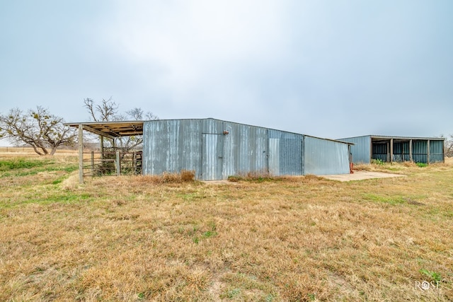 view of outdoor structure with a yard