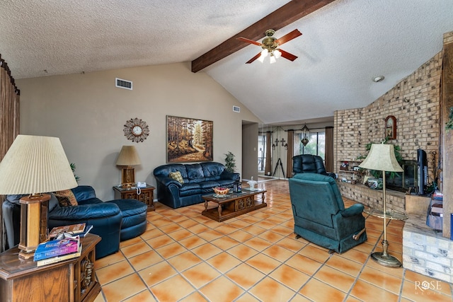 tiled living room with lofted ceiling with beams, ceiling fan, and a textured ceiling