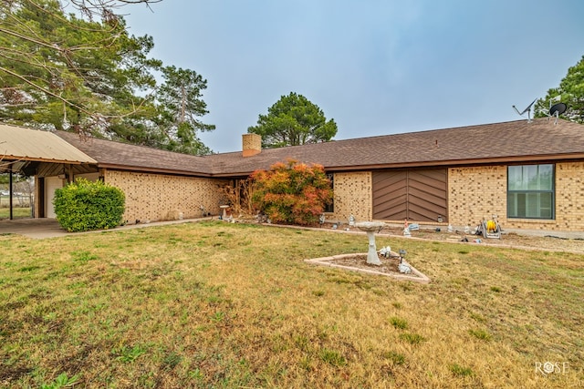 ranch-style home featuring a front yard