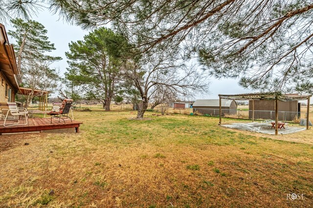 view of yard with a wooden deck