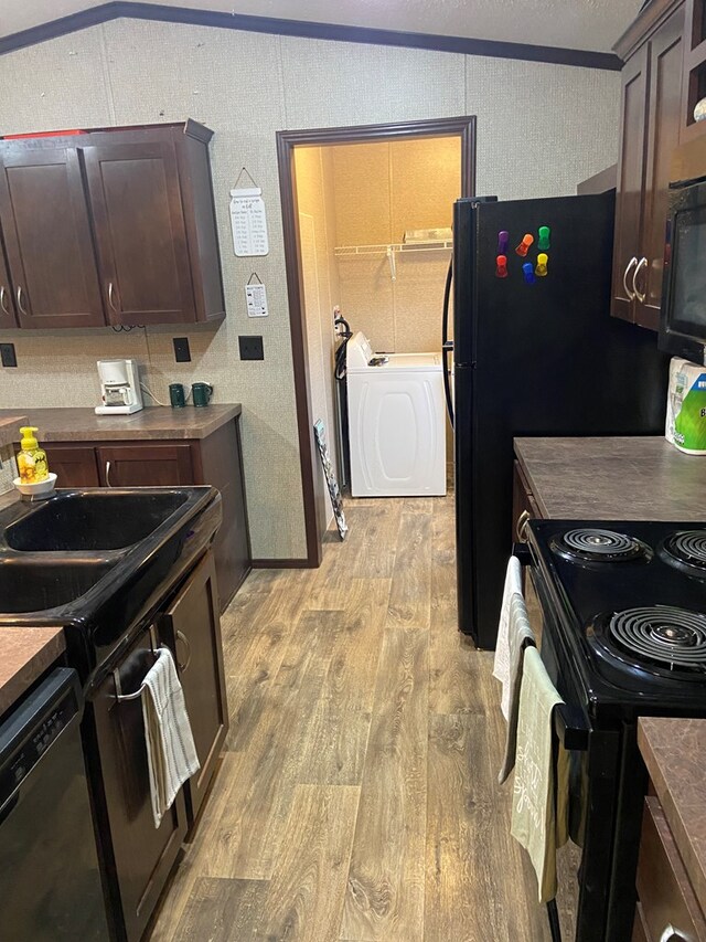 kitchen with crown molding, light hardwood / wood-style flooring, black appliances, and dark brown cabinets