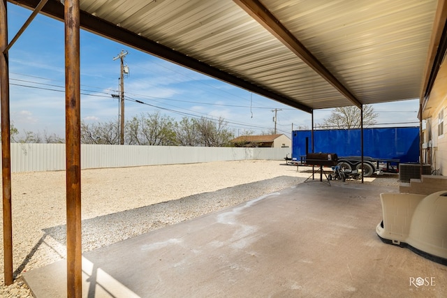 307 E 12th St, Big Lake, TX 76932 - view of patio featuring central AC and a fenced backyard