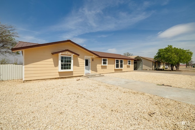 307 E 12th St, Big Lake, TX 76932 - single story home with metal roof, fence, and entry steps